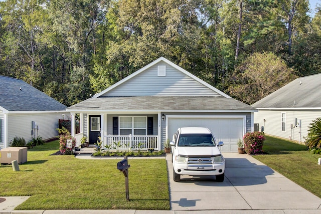 view of front of house featuring a garage, a porch, and a front lawn