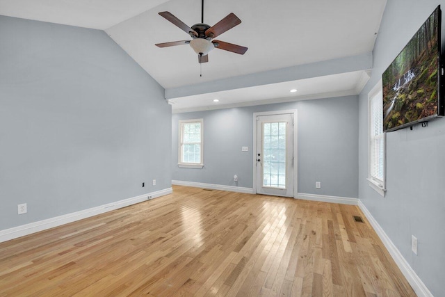 spare room with lofted ceiling, light hardwood / wood-style floors, and ceiling fan