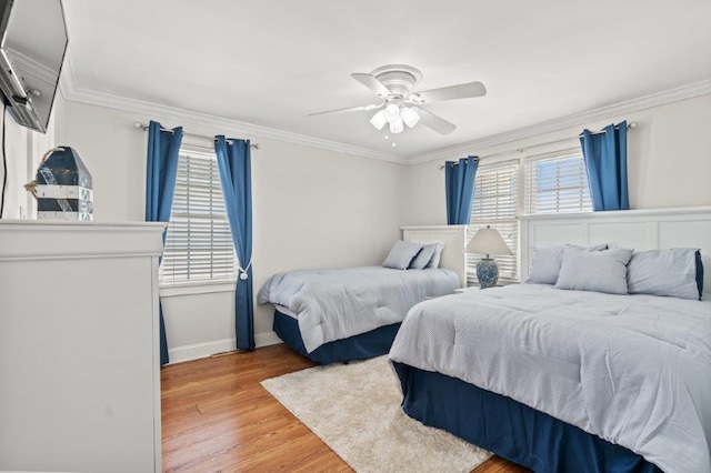 325 N 58th Ave, North Myrtle Beach, SC 29582 - bedroom with light wood-style flooring, crown molding, and ceiling fan