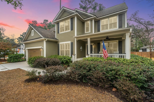 view of front of property with a garage and a porch