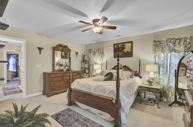 bedroom featuring ceiling fan and light carpet