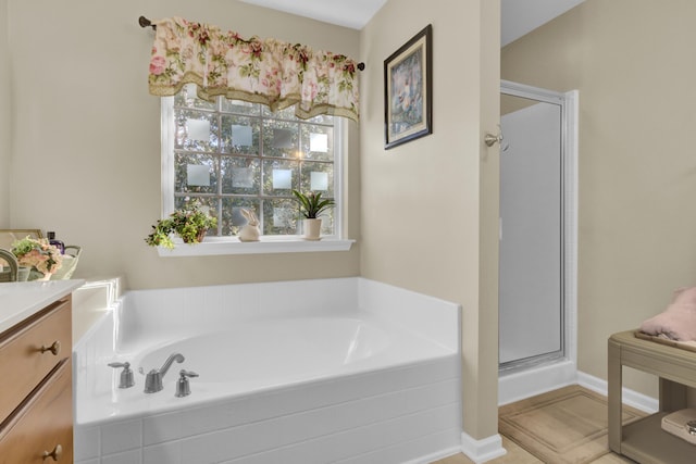 bathroom with vanity and plus walk in shower