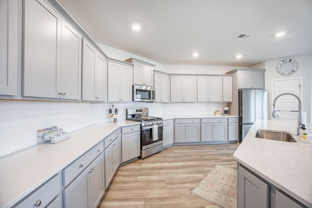 533 Richfield Way, Summerville, SC 29486 - kitchen with decorative backsplash, visible vents, a sink, stainless steel appliances, and recessed lighting