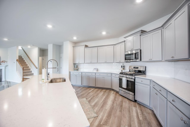 533 Richfield Way, Summerville, SC 29486 - kitchen featuring light countertops, a sink, gray cabinets, and stainless steel appliances