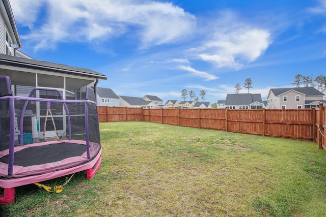 533 Richfield Way, Summerville, SC 29486 - view of yard with a sunroom, a residential view, a fenced backyard, and a trampoline