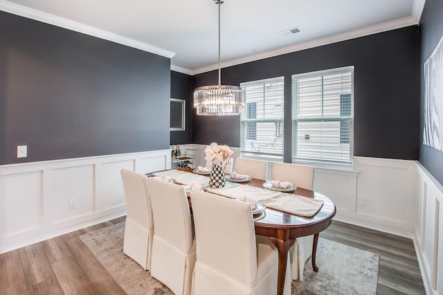 533 Richfield Way, Summerville, SC 29486 - dining area with a decorative wall, light wood-style floors, an inviting chandelier, and a wainscoted wall