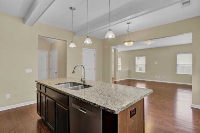 kitchen featuring sink, beam ceiling, a center island with sink, decorative light fixtures, and dishwasher