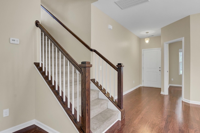 stairs with wood-type flooring