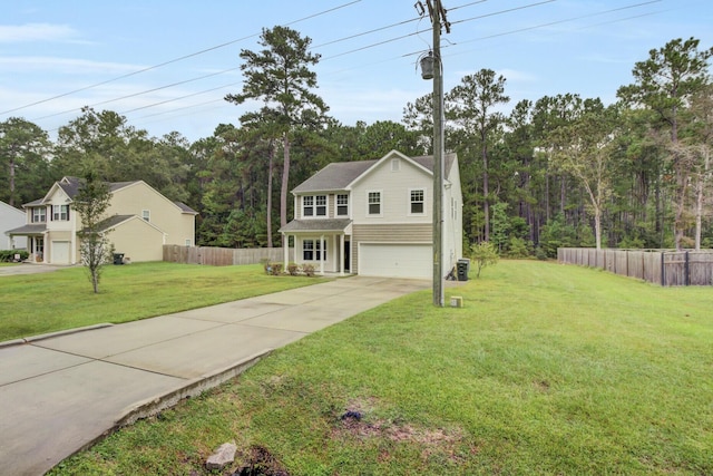 view of front of property with a front yard and a garage