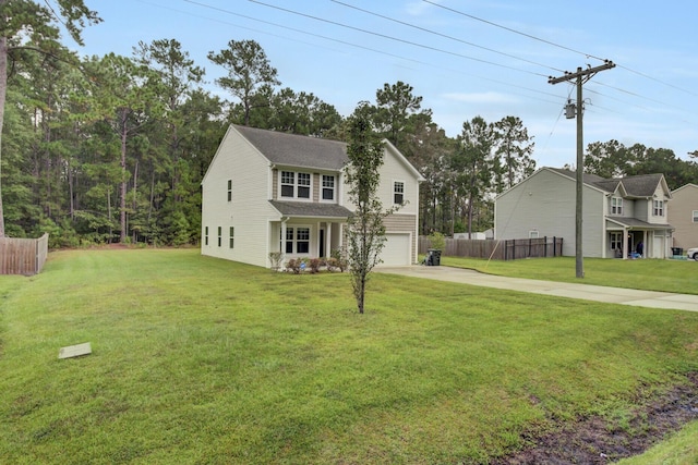 view of front of home featuring a front yard and a garage