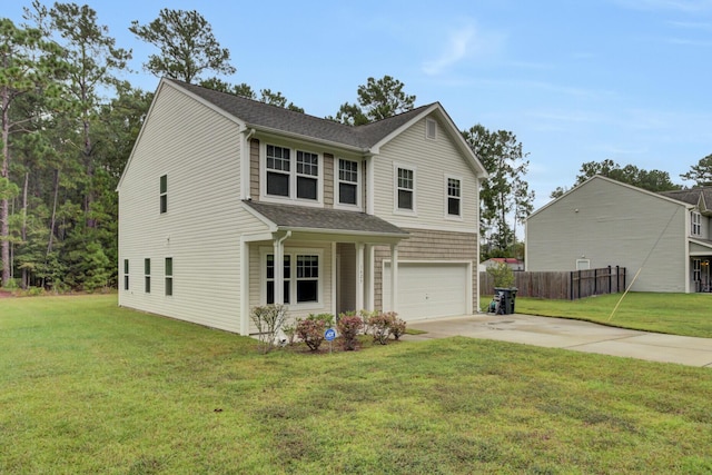 view of front facade with a front yard and a garage