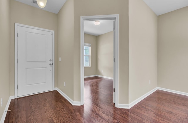 entryway with dark hardwood / wood-style floors