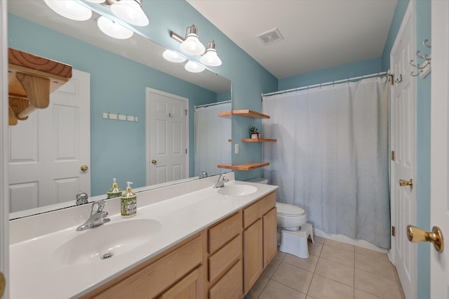 bathroom with tile patterned flooring, vanity, curtained shower, and toilet