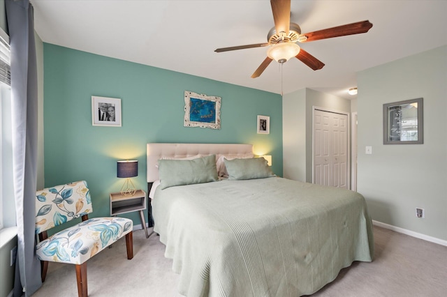 bedroom featuring ceiling fan, a closet, and carpet floors