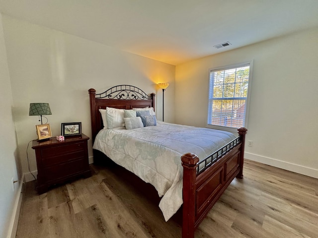 bedroom with light hardwood / wood-style floors