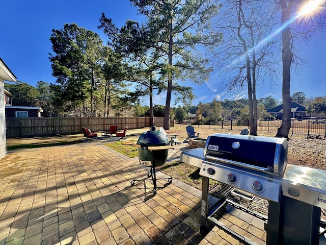 view of patio / terrace featuring a mountain view and grilling area