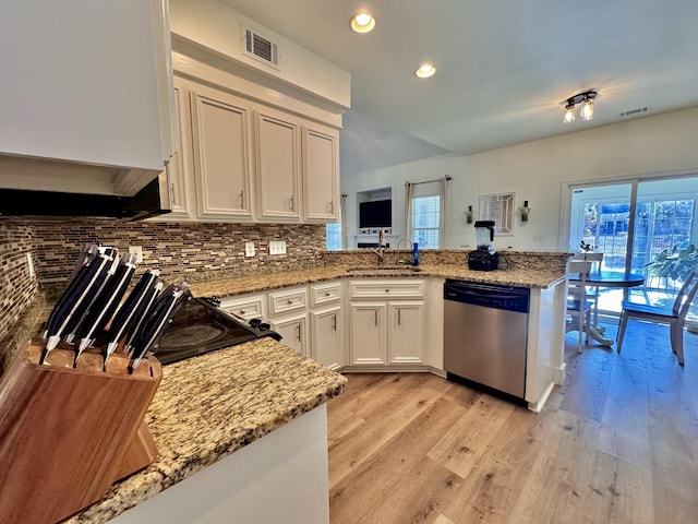 kitchen with dishwasher, white cabinets, sink, kitchen peninsula, and light stone counters