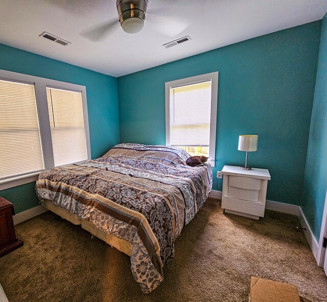 carpeted bedroom with ceiling fan