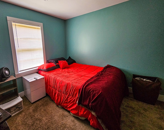 bedroom with dark carpet