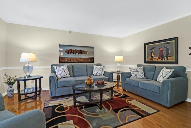 living room featuring baseboards and wood finished floors