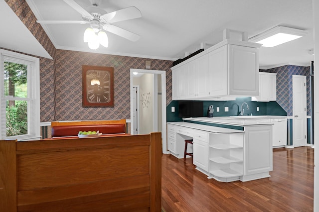 kitchen featuring white cabinets, wallpapered walls, open shelves, and crown molding