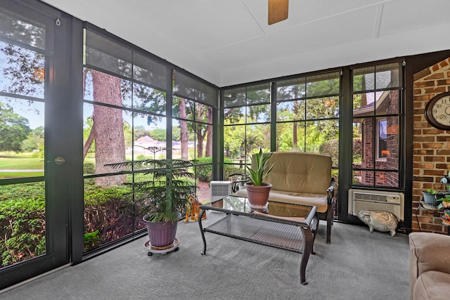 sunroom / solarium featuring ceiling fan