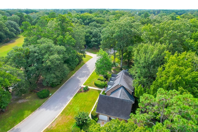 drone / aerial view featuring a view of trees