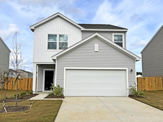 traditional-style house featuring concrete driveway and a garage