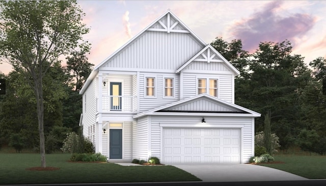 view of front of home with a garage and a lawn