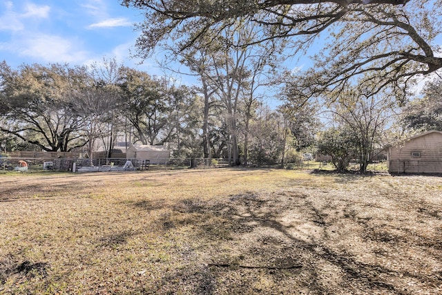 view of yard featuring fence