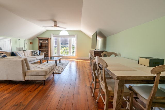 dining room with lofted ceiling, ceiling fan, and hardwood / wood-style floors