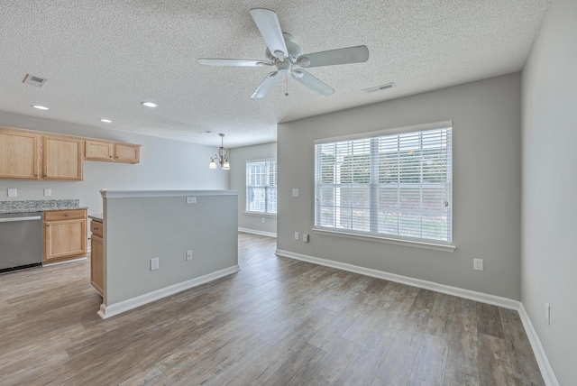 kitchen with visible vents, dishwasher, and light wood-type flooring