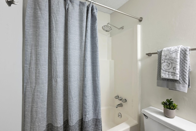full bath featuring shower / tub combo with curtain and toilet