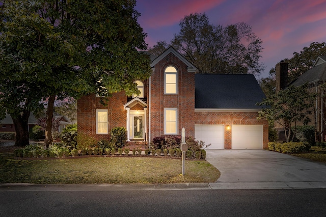1324 Southlake Dr, Mount Pleasant, SC 29464 - view of front of house featuring brick siding, a front yard, driveway, and a garage