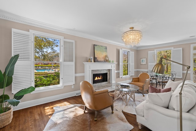 1324 Southlake Dr, Mount Pleasant, SC 29464 - living room with baseboards, a wealth of natural light, wood finished floors, and a chandelier