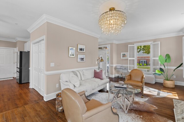 1324 Southlake Dr, Mount Pleasant, SC 29464 - living area with an inviting chandelier, ornamental molding, baseboards, and wood finished floors