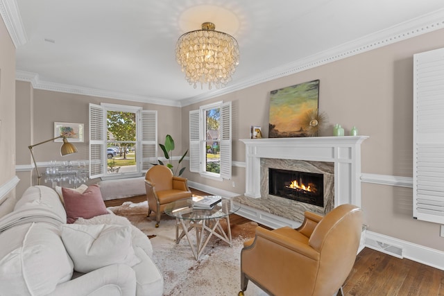 1324 Southlake Dr, Mount Pleasant, SC 29464 - living area with crown molding, baseboards, a notable chandelier, a fireplace, and wood finished floors
