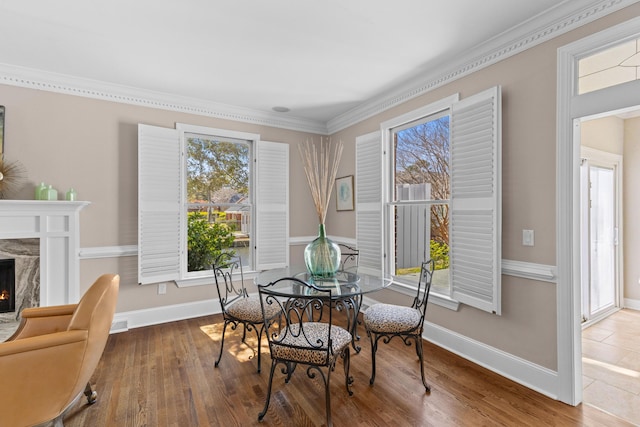 1324 Southlake Dr, Mount Pleasant, SC 29464 - dining space with a healthy amount of sunlight, a fireplace, and wood finished floors