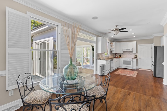 1324 Southlake Dr, Mount Pleasant, SC 29464 - dining area featuring crown molding, baseboards, dark wood-style floors, visible vents, and a ceiling fan