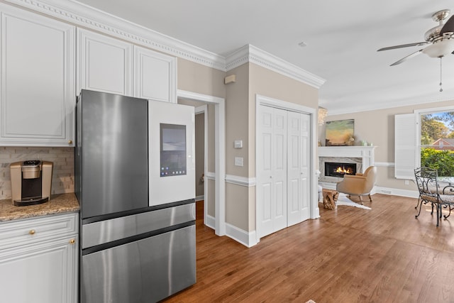 1324 Southlake Dr, Mount Pleasant, SC 29464 - kitchen featuring tasteful backsplash, light wood-style flooring, ornamental molding, a ceiling fan, and smart refrigerator