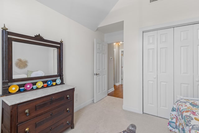 1324 Southlake Dr, Mount Pleasant, SC 29464 - bedroom with light colored carpet, vaulted ceiling, a closet, and baseboards