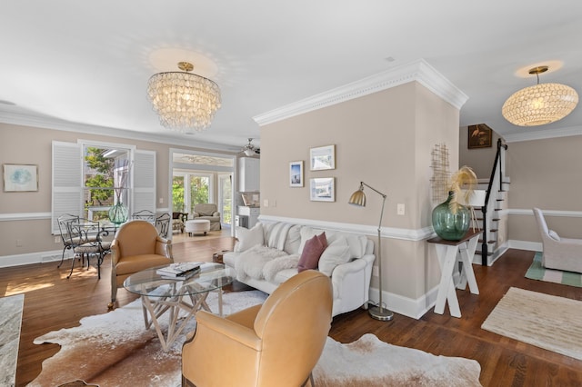 1324 Southlake Dr, Mount Pleasant, SC 29464 - living room featuring stairs, a notable chandelier, wood finished floors, baseboards, and ornamental molding