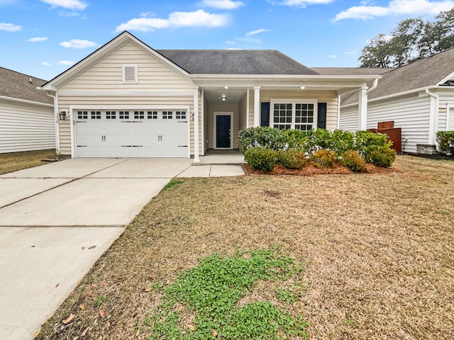 ranch-style home with a front yard and a garage