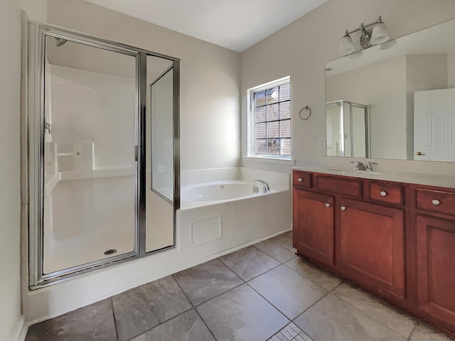 bathroom with vanity, shower with separate bathtub, and tile patterned flooring