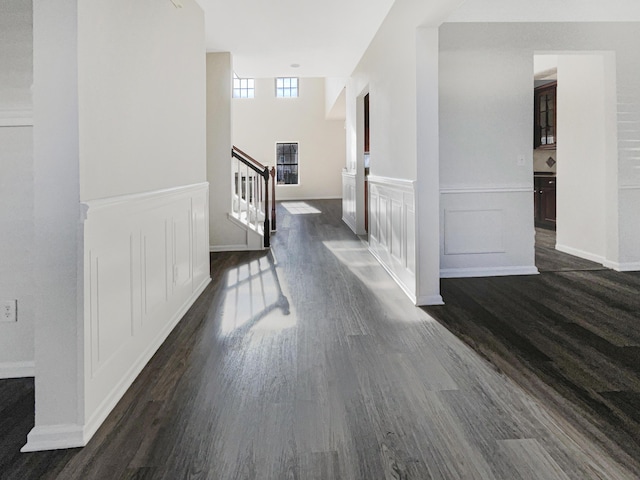 hall with dark hardwood / wood-style floors