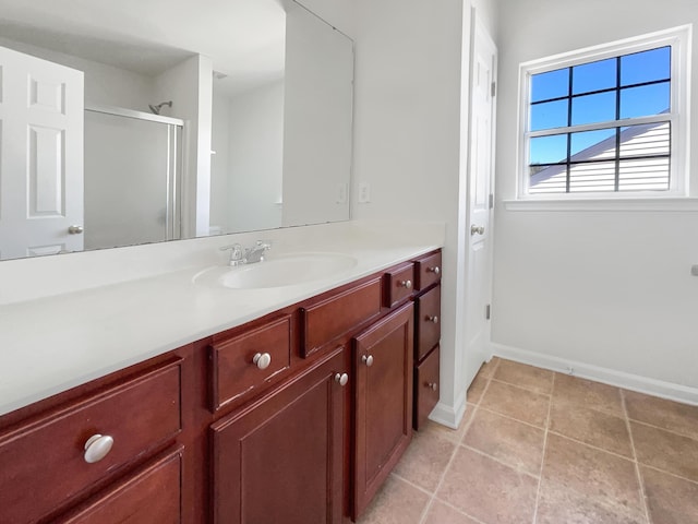 bathroom featuring walk in shower and vanity