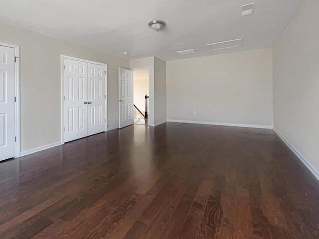 unfurnished room featuring dark hardwood / wood-style floors