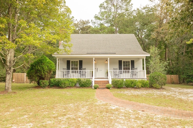 view of front of property with a front yard and a porch