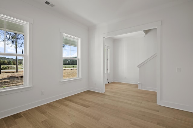 100 E Carolina Ave, Summerville, SC 29483 - unfurnished room featuring plenty of natural light, light wood-style flooring, and baseboards