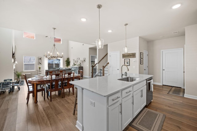 291 Lucca Dr, Summerville, SC 29486 - kitchen with dishwasher, white cabinetry, a kitchen island with sink, recessed lighting, and wood finished floors